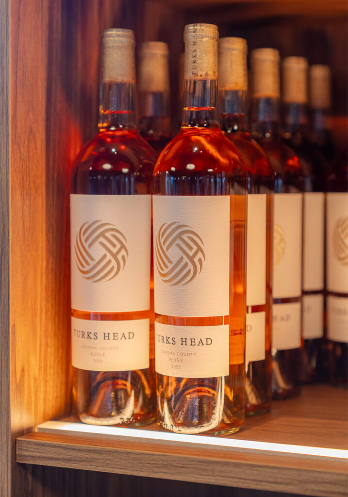 bottles of wine illuminated on shelf