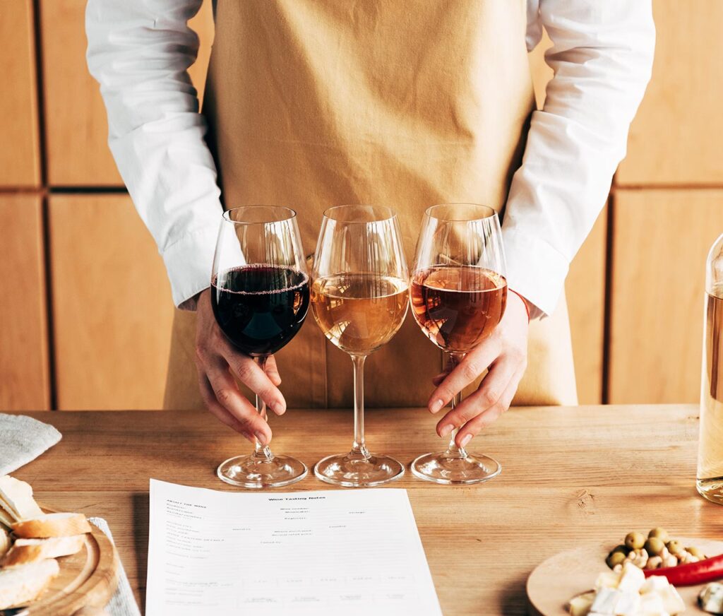 sommelier holding a wine flight